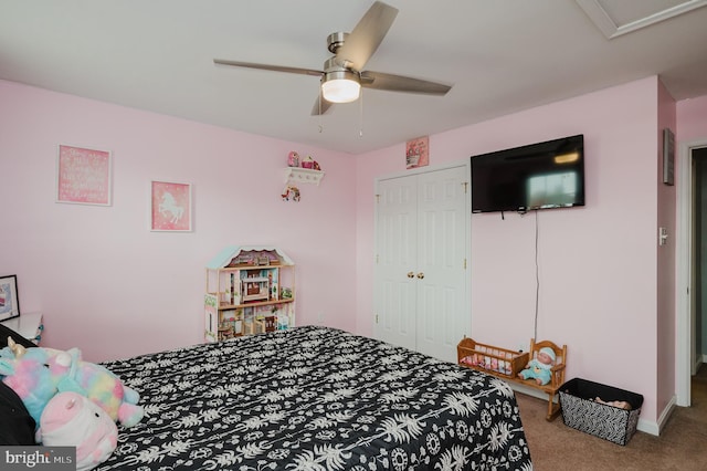 carpeted bedroom with a closet and ceiling fan