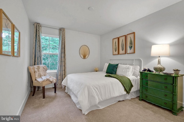 bedroom featuring light colored carpet