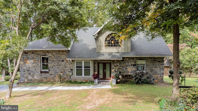 view of front of property featuring french doors and a front yard