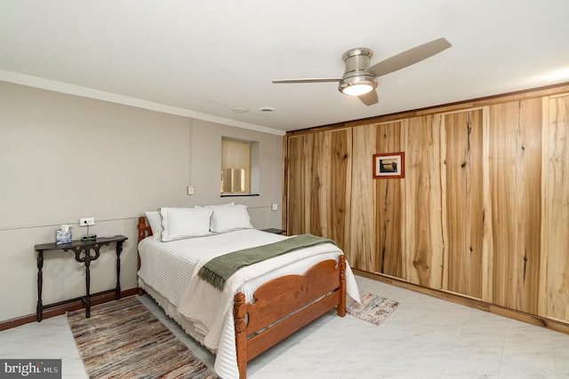 bedroom with crown molding and ceiling fan