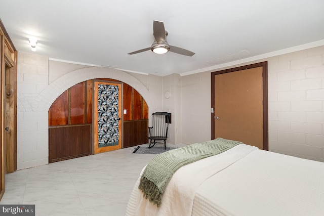 bedroom with ceiling fan and ornamental molding