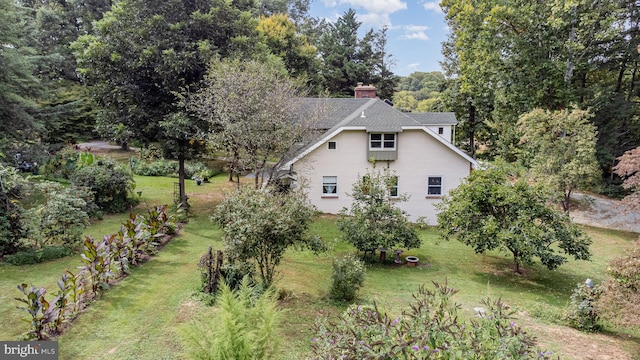 view of home's exterior with a lawn