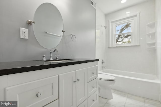 full bathroom with tub / shower combination, vanity, and toilet