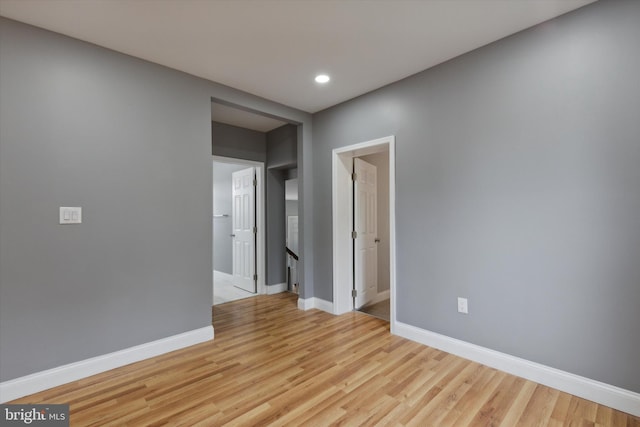 unfurnished room with light hardwood / wood-style floors