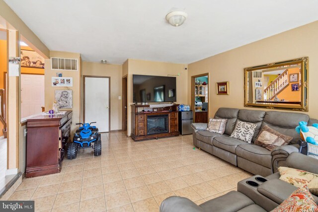 living room with light tile patterned floors