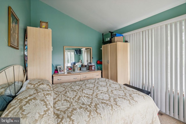 bedroom featuring lofted ceiling