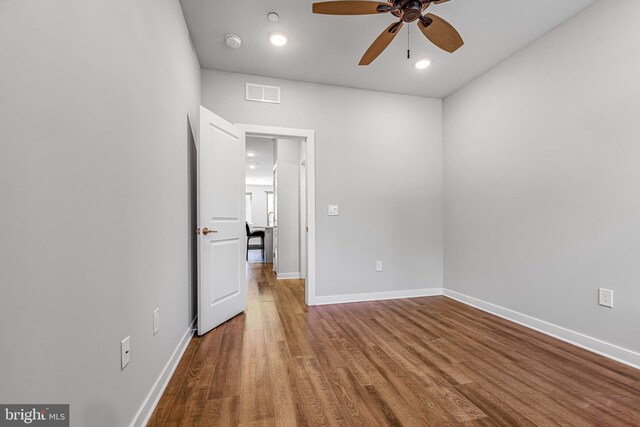 unfurnished bedroom featuring ceiling fan and hardwood / wood-style flooring