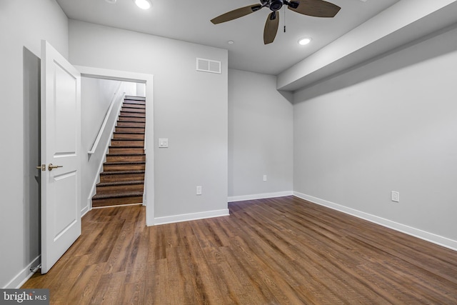 interior space with ceiling fan and dark wood-type flooring