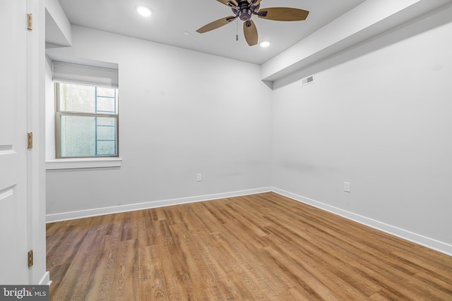 spare room with ceiling fan and hardwood / wood-style floors