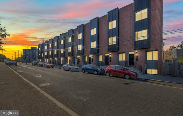 view of outdoor building at dusk