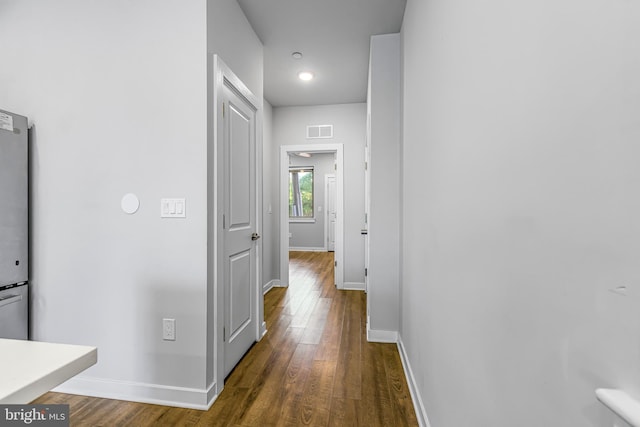 hallway featuring dark wood-type flooring