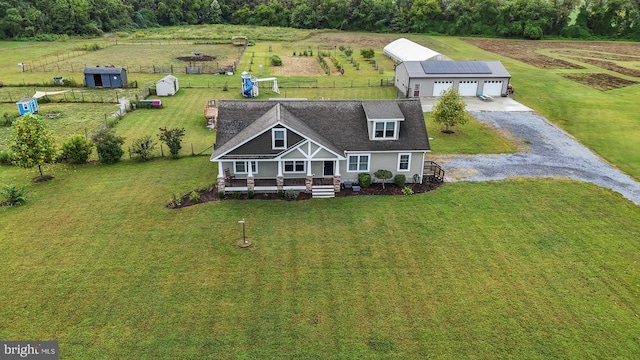 birds eye view of property with a rural view