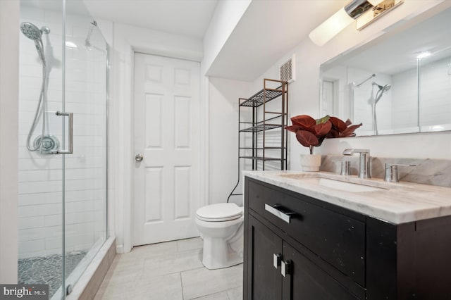 full bathroom with toilet, a stall shower, tile patterned floors, and vanity