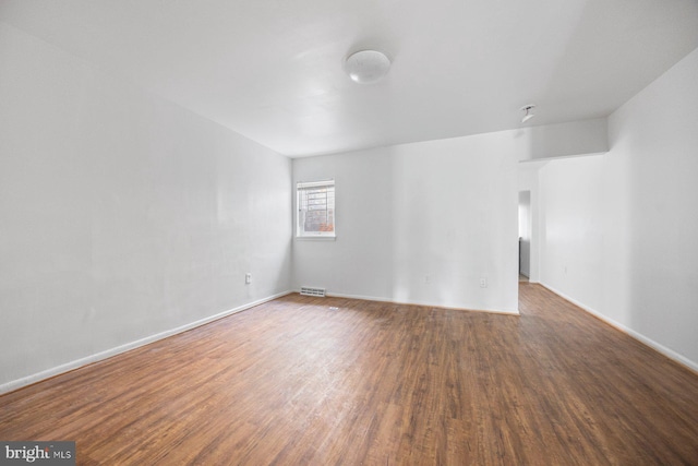 spare room featuring hardwood / wood-style flooring