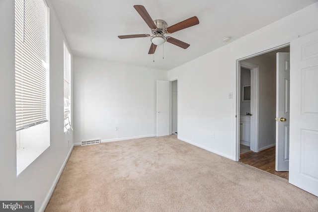 unfurnished bedroom with ceiling fan and carpet flooring