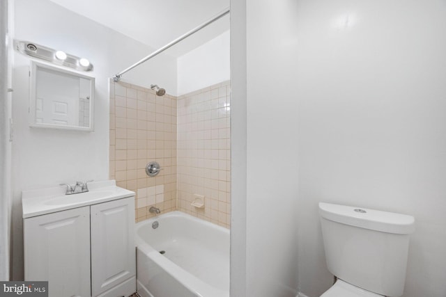 full bathroom featuring vanity, toilet, and tiled shower / bath