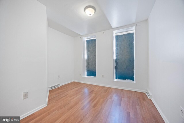 spare room featuring light hardwood / wood-style flooring