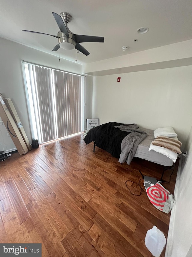 bedroom featuring ceiling fan and hardwood / wood-style floors