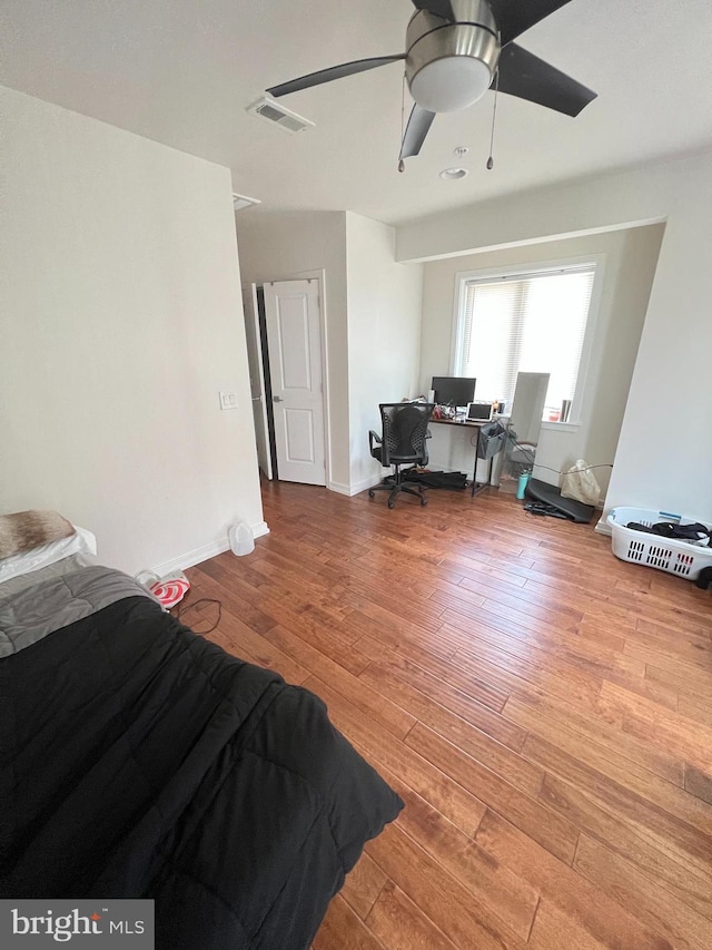 bedroom featuring light hardwood / wood-style flooring and ceiling fan