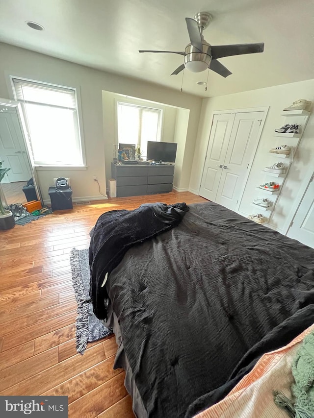 bedroom featuring ceiling fan and hardwood / wood-style floors