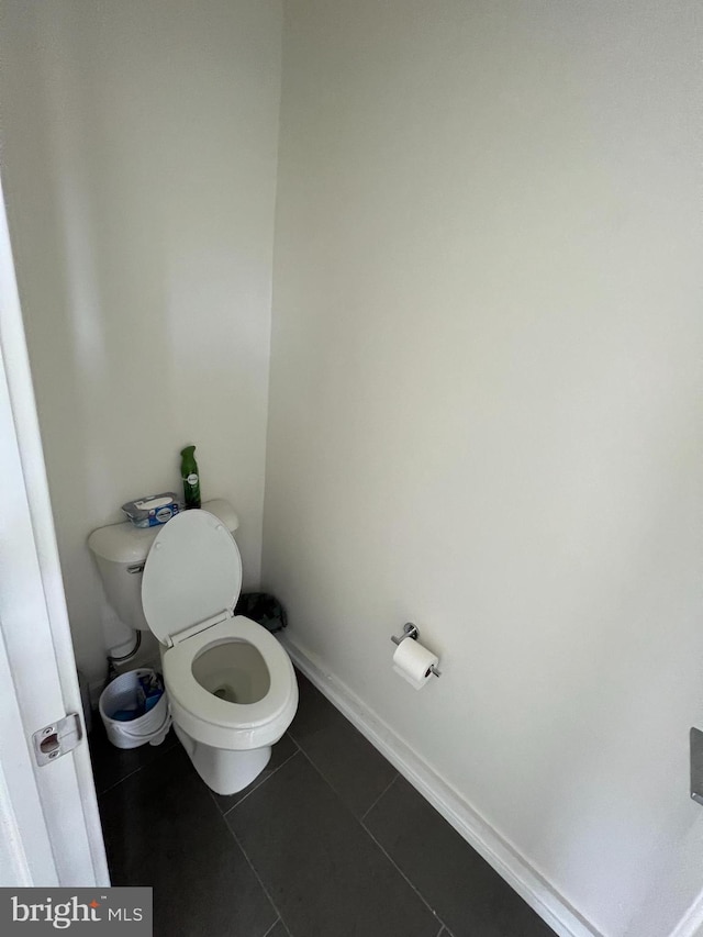 bathroom with tile patterned floors and toilet