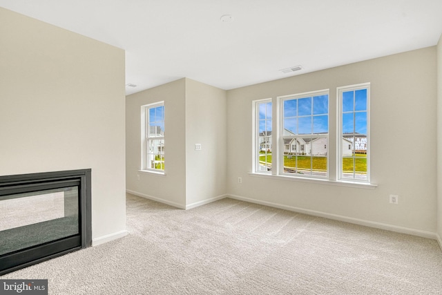 118 Pawn Ct, Winchester, VA 22602 - unfurnished living room featuring carpet floors, healthy amount of natural light, and baseboards