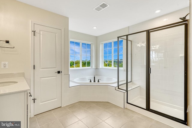 full bathroom featuring vanity, visible vents, a shower stall, tile patterned floors, and a bath