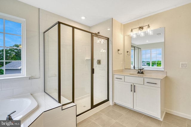 bathroom featuring vanity, visible vents, a shower stall, a garden tub, and tile patterned floors