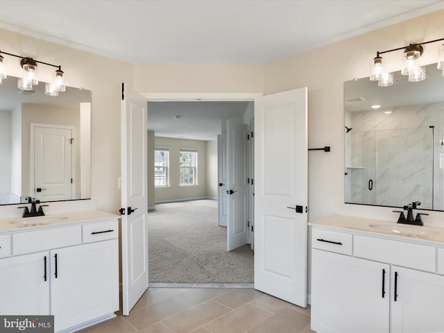 118 Pawn Ct, Winchester, VA 22602 - bathroom featuring a marble finish shower, two vanities, and tile patterned floors