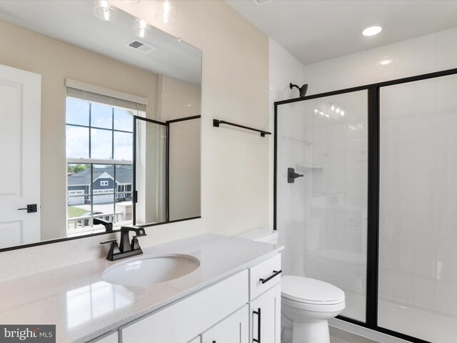 118 Pawn Ct, Winchester, VA 22602 - bathroom featuring a shower stall, toilet, vanity, and recessed lighting