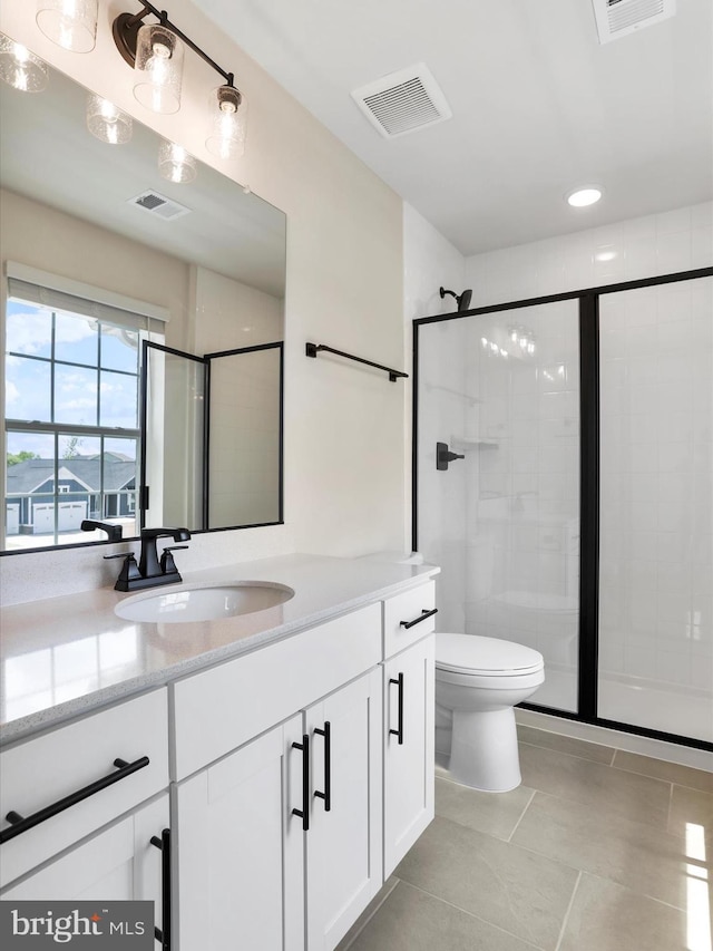 118 Pawn Ct, Winchester, VA 22602 - bathroom featuring a stall shower, tile patterned flooring, vanity, toilet, and recessed lighting