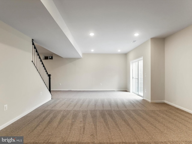 118 Pawn Ct, Winchester, VA 22602 - unfurnished living room with carpet flooring, stairs, baseboards, and recessed lighting