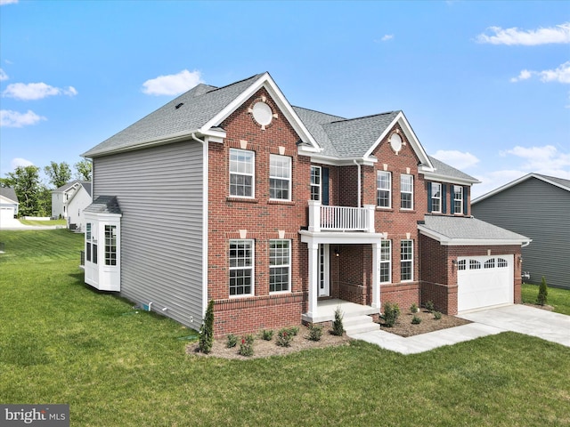 118 Pawn Ct, Winchester, VA 22602 - colonial home featuring driveway, brick siding, a front lawn, a balcony, and roof with shingles