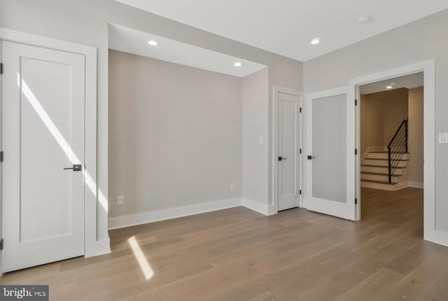 unfurnished bedroom with wood-type flooring