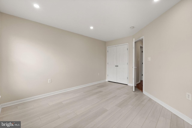 unfurnished bedroom featuring light wood-type flooring