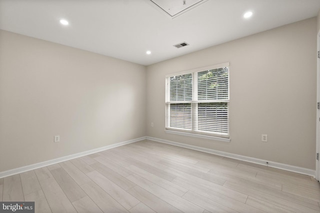 unfurnished room with light hardwood / wood-style floors