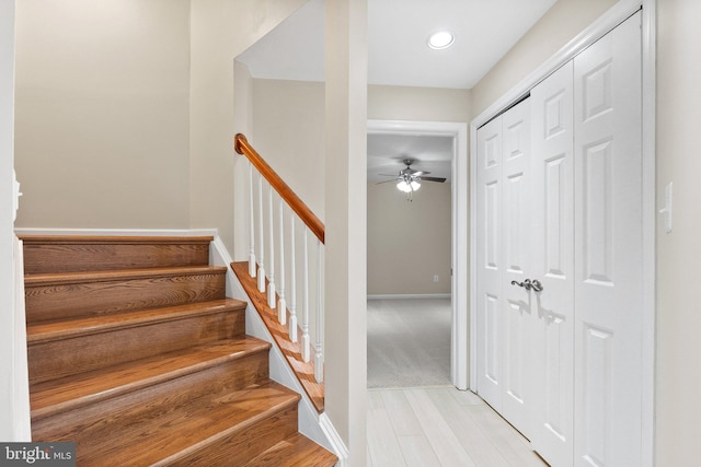 foyer with ceiling fan and light hardwood / wood-style flooring