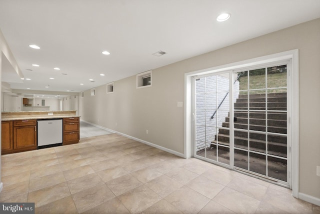 kitchen featuring dishwasher and light tile patterned floors