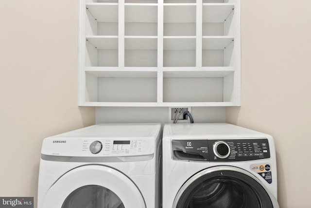 washroom featuring washer and clothes dryer