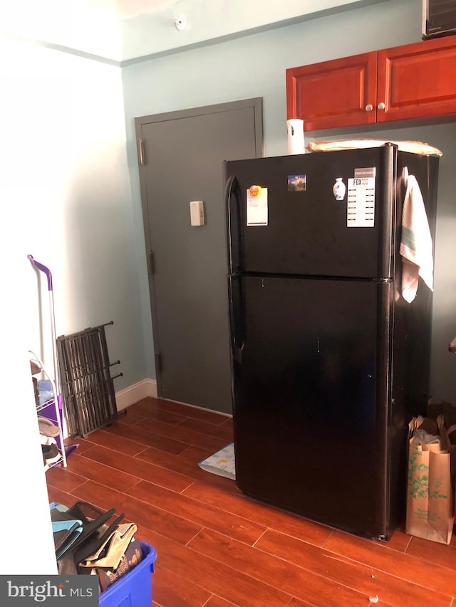 foyer entrance with hardwood / wood-style floors