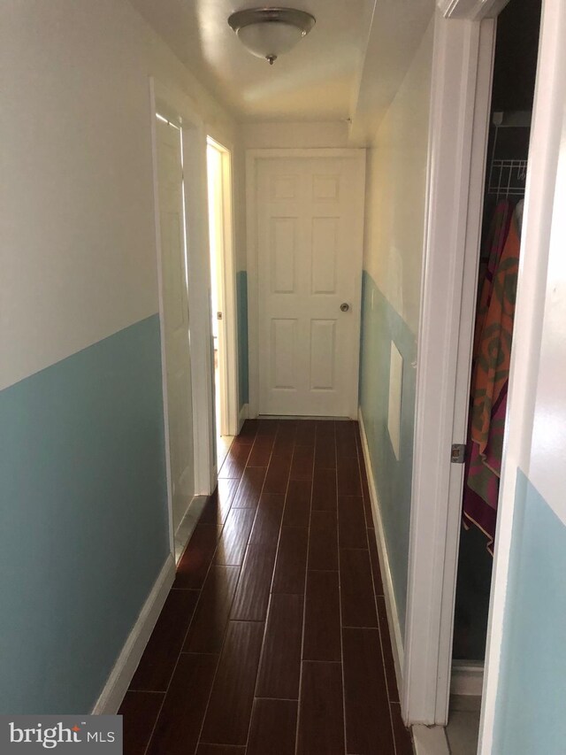 hallway featuring dark hardwood / wood-style floors