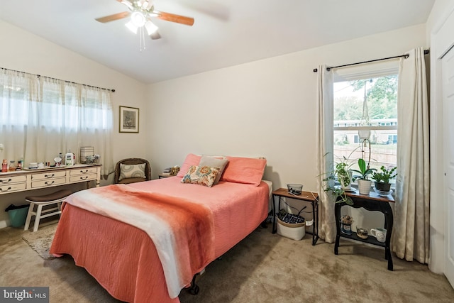 carpeted bedroom featuring lofted ceiling and ceiling fan