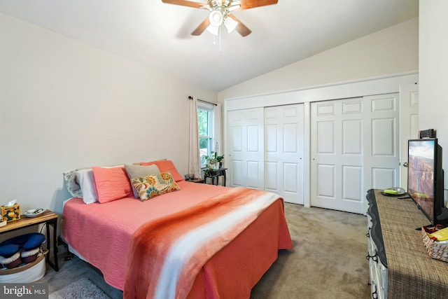 carpeted bedroom featuring vaulted ceiling, ceiling fan, and a closet