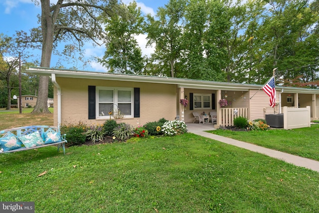 single story home featuring a front lawn and central AC unit