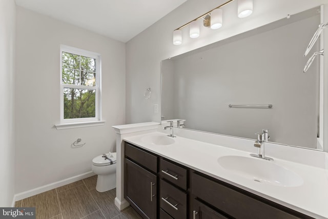 bathroom with vanity and toilet