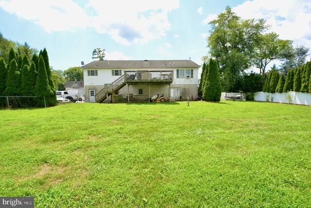 back of house with a lawn