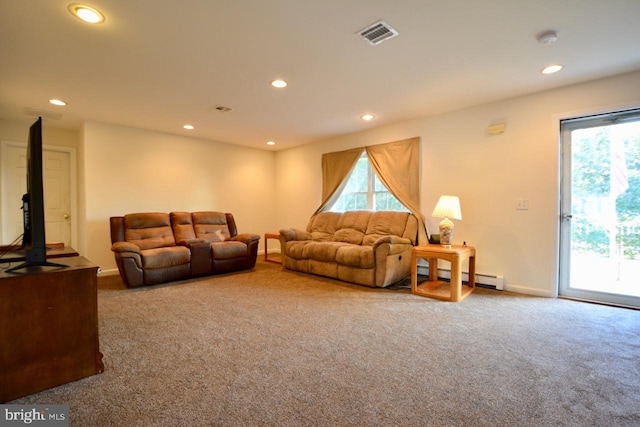 carpeted living room featuring baseboard heating