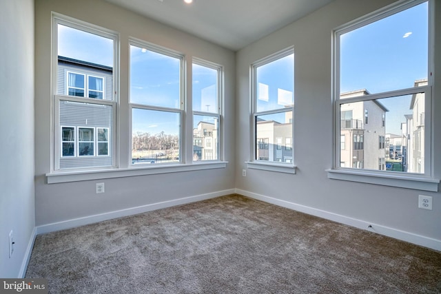 empty room with carpet and plenty of natural light