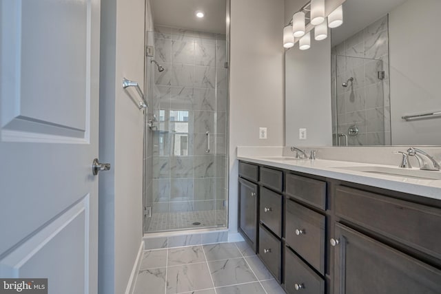 bathroom with walk in shower and vanity