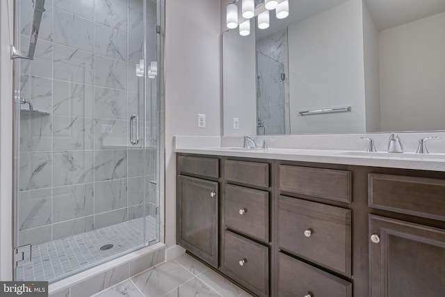 bathroom featuring walk in shower and vanity